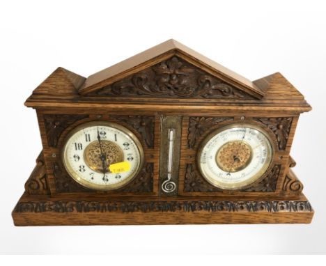 A Victorian carved oak combination mantle clock / thermometer / barometer, width 39cm. 