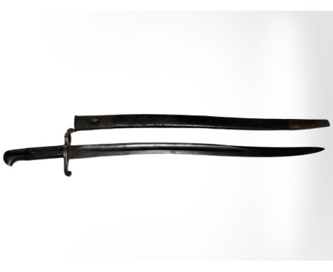 A British Pattern 1863 Whitworth sword bayonet in its steel-mounted leather scabbard, pommel stamped '707', blade 58cm long.
