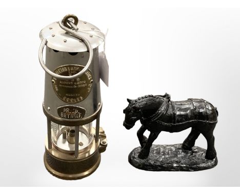 An Eccles SL miners lamp, together with a sculpture of a horse constructed of coal. 