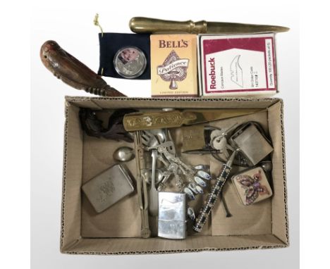 A small box of collectibles including Budweiser lighter, brass letter knives, oriental carved wooden koi fish, travelling ink