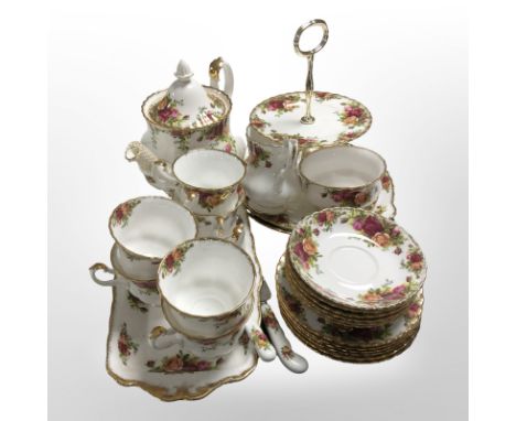A Royal Albert Old Country Roses 21 piece tea service, together with rectangular shallow tray, a two tier cake stand, knife a