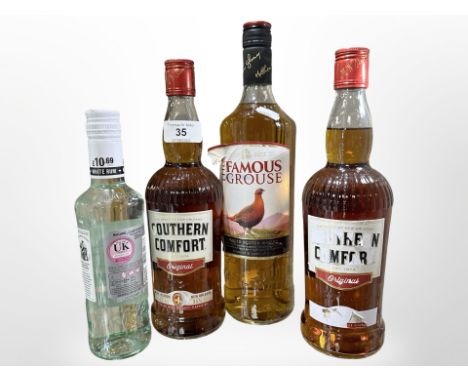 Two bottles of Southern Comfort liqueur 70cl, together with one bottle of Famous Grouse blended scotch whisky 1L. (3) 