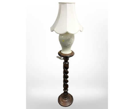 A barley twist torchère and a ceramic table lamp. 