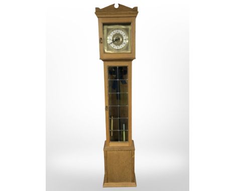A West German oak longcase clock, height 198 cm
