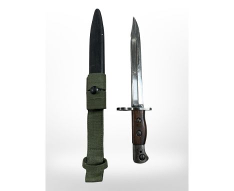A British Military bayonet No. 5 knife bayonet, with scabbard, plain wood grips and 20cm Bowie blade, stamped 'WSC' (Wilkinso