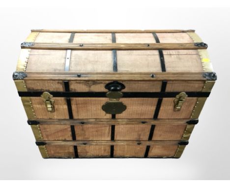 An early 20th century domed shipping trunk, width 76 cm 