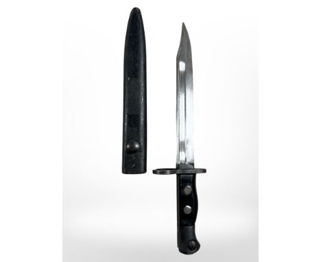 A British bayonet for the Sterling submachine gun L2A1, with scabbard, black plastic grips and 20cm bowie blade.