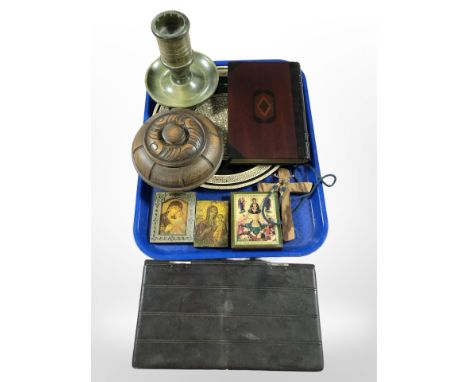 A group of reproduction religious icons, a crucifix, a mother-of-pearl-inlaid charger, turned wooden candlestick, two table b