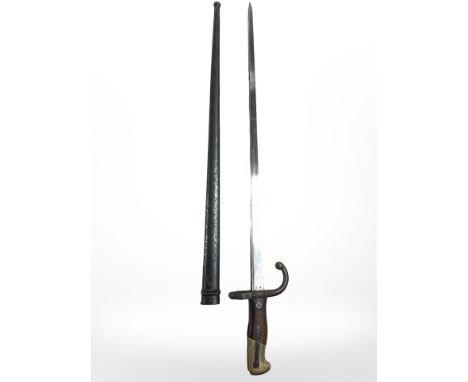 A French Gras Epee bayonet Modele 1874 bayonet with wood grips and steel scabbard, manufactured St. Etienne 1876, bayonet and