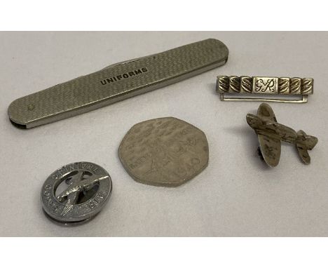 A small collection of military related items. Comprising: Air Training Corps badge, small white metal aircraft brooch, white 