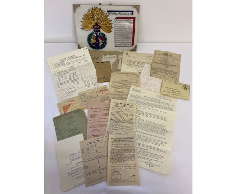 A collection of military paperwork relating to L/Cpl J.E. Jones, Royal Fusiliers national service. Together with a handmade R