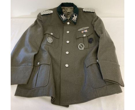A replica WWII German SS officers Obergrupenfuhrer tunic with epaulettes and badges.  Size Large.