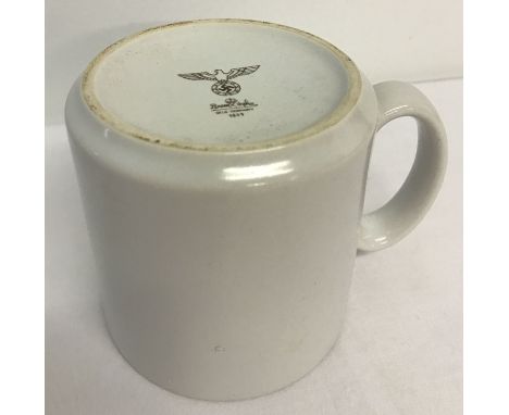A WWII style German Army white ceramic mug. Printed to underside with Rosenthal makers mark, Nazi eagle mark and date. Approx