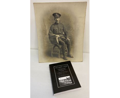 A photographic portrait of a WWI soldier in uniform. Together with a copy of "The Silent Cities; An Illustrated Guide To The 