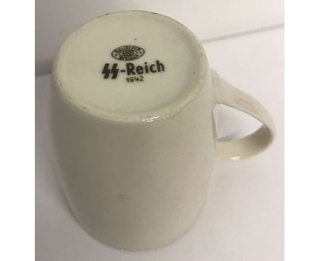 A German WWII style Waffen SS white ceramic coffee mug. Printed to underside with SS mark and date. Approx. 10.5cm tall x 8cm