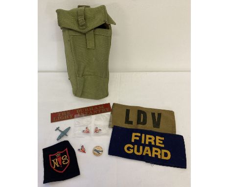 A small collection of military items to include khaki canvas carry pouch. Lot also includes Fire Guard and LDV armbands, a sm