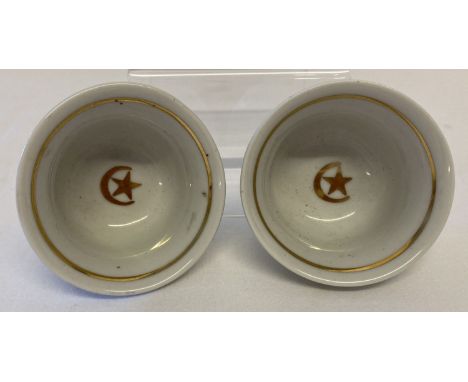 2 ceramic tea cups with gilt detail, in the style of WWI Turkish Ottoman Officers tea cups.  Approx. 3.5cm tall x 6.25cm diam