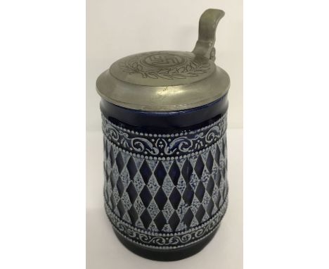 A Marzi &amp; Remy German ceramic beer stein with deep blue glaze and pewter lid. Lid engraves with WWII style Nazi logo. App