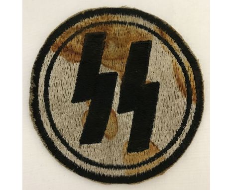 A German WWII style late war ersatz SS circular embroidered PT vest patch.  Approx. 8.5cm diameter.