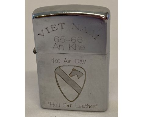 A Vietnam war style 1st Air Cav. Windproof lighter with engraved detail to both sides.  