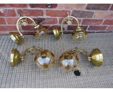 A SET OF FOUR BRASS EFFECT WALL LIGHT FITTINGS WITH RETRO GLASS SHADES