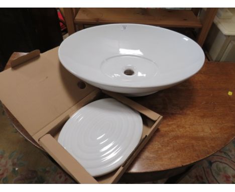 A MODERN DESIGNER STYLE SINK BASIN 