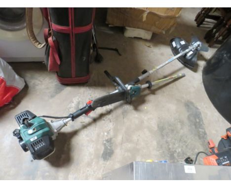 A PARKSIDE PETROL STRIMMER WITH CHAINSAW ATTACHMENT