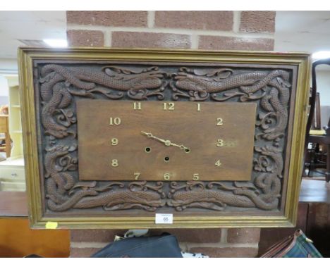 A RECTANGULAR WESTMINSTER CHIME WALL CLOCK WITH HAND CARVED DRAGON FRIEZE