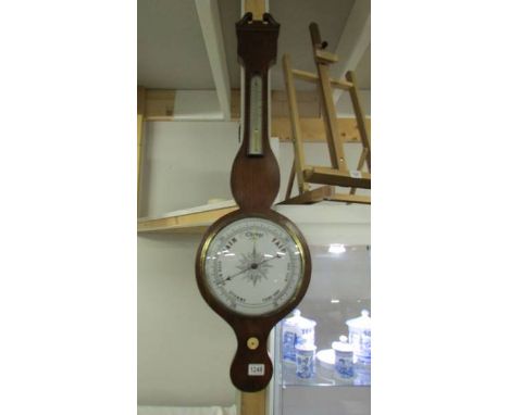 A mahogany banjo barometer.