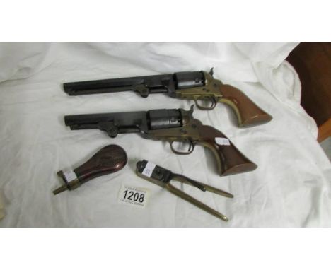 A replica navy colt, a replica army colt, a bullet moould and a powder flask (Italian Replica's?).*Condition report*All piece