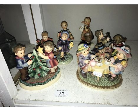 3 Goebel Hummel figure groups, Autumn Arrival, Puppy Surprise and Christmas Fun and 2 Goebel figures*Condition report*All und