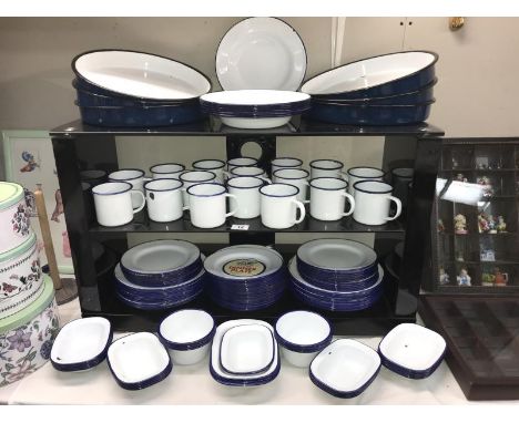 A large quantity of blue and white Falcon enamel dinner ware including mugs, plates etc.