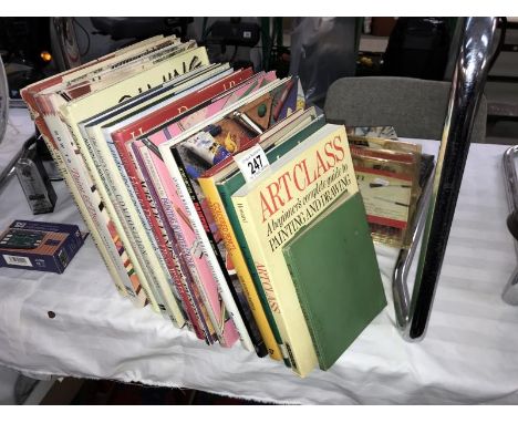 A quantity of reference books on art &amp; a packet of paint brushes etc.