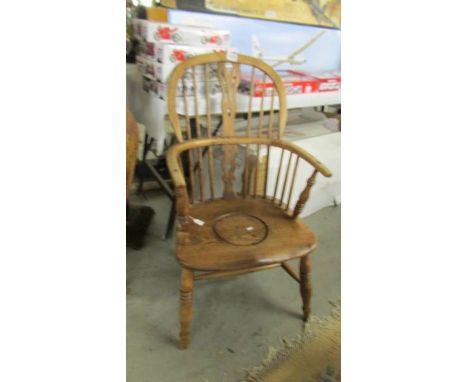A 19th century Windsor style commode chair.