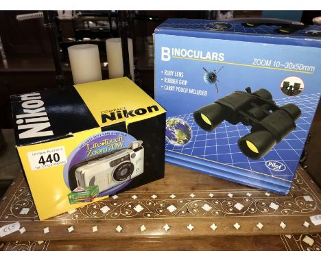 A boxed set of binoculars &amp; a boxed Nikon compact camera