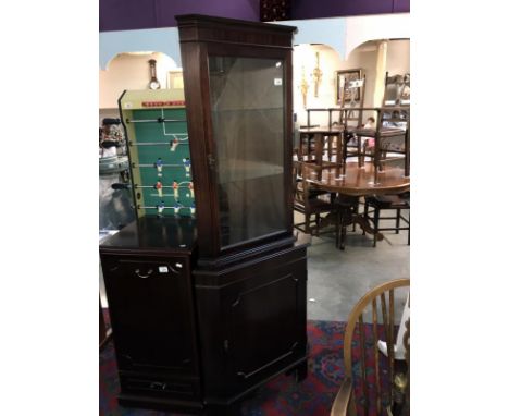 A dark wood stained corner cupboard with cut glass door panel. 70cm x49cm x Height 184cm (COLLECT ONLY)