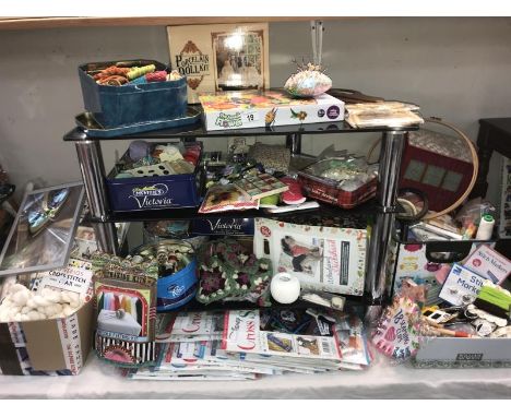 A fabulous lot of sewing equipment, buttons, cotton, tapestry wool, a number of cross stitches new in bags, includes craft bo