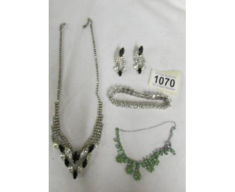 Two vintage necklaces, one with matching earrings and a bracelet in paste.