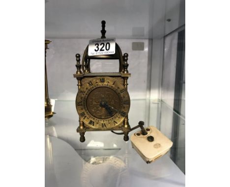 A Smiths electric brass lantern clock