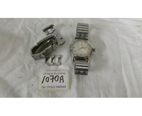 A vintage Rolex Oyster perpetual wrist watch, (ticking but needs attention).*Condition report*Watch runs, winder unable to se
