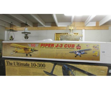 A boxed 1/5 scale Piper J-3 Cub R.C. model aircraft kit, unchecked for completeness.