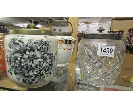 Two ceramic biscuit barrels and a glass biscuit barrel.