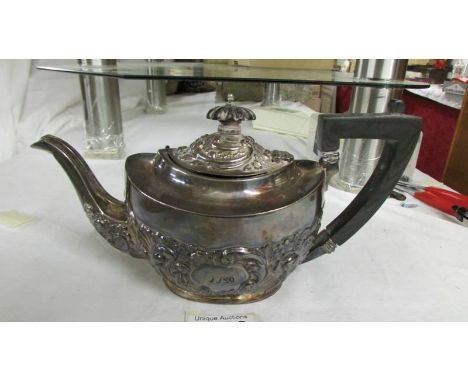 A decorative silver teapot, approximately 330 grams.*Condition report*No soldered repairs or serious dents. Some small dents,