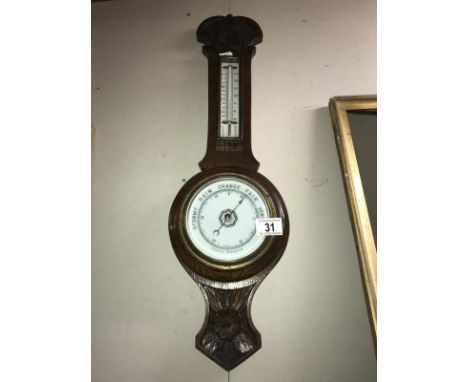 An Edwardian oak aneroid barometer COLLECT ONLY