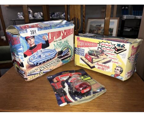 A boxed Captain Scarlett and Thunderbirds talking alarm clock. Working when tested
