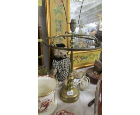 A heavy brass table lamp base.
