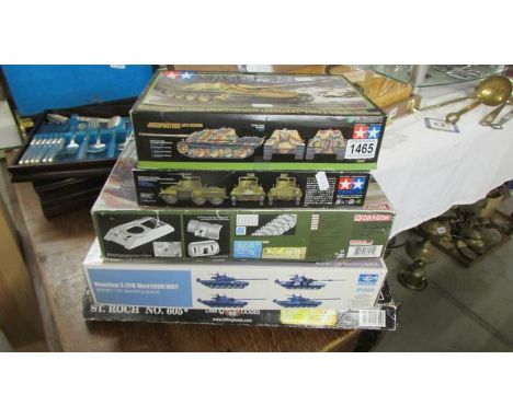 Five tank model kits and a model boat kit.
