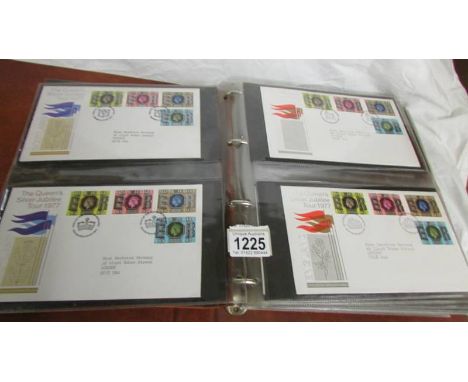 Two folders of first day covers.