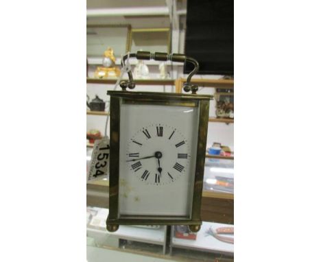 A brass carriage clock.