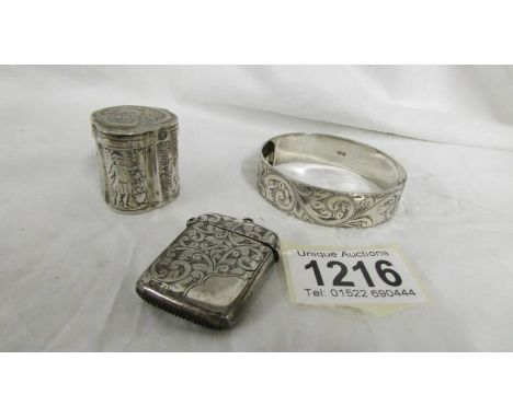 A silver vesta case, a silver snuff box and a silver bangle, 65 grams.*Condition report*All are fully hallmarked Silver.